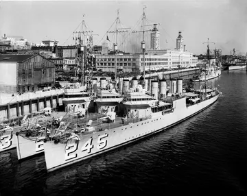 Black-and-white photograph: Rose Festival, Willamette River with Battleships, 1940s. Location: Portland, Oregon. Date: c. 1940s.