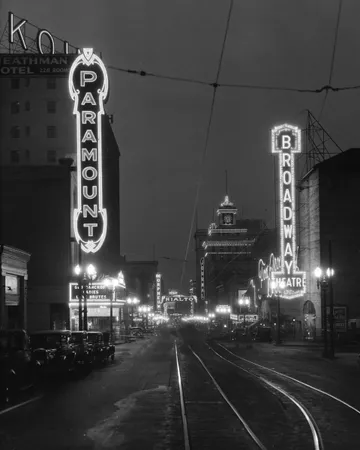 Black-and-white photograph: Broadway and Paramount Theaters, Portland, 1940s. Location: Portland, Oregon. Date: c. 1940s.
