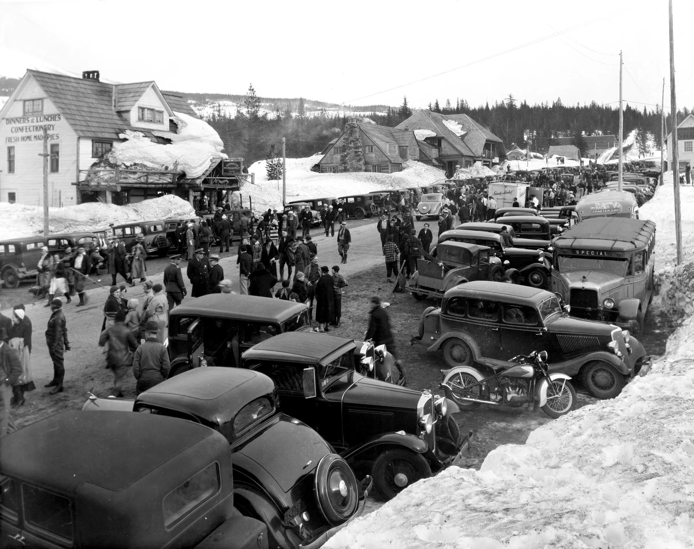 Black-and-white photograph: Winter Crowd at Government Camp, 1940s. Location: Government Camp, Mt. Hood, Oregon. Date: c. 1940s.