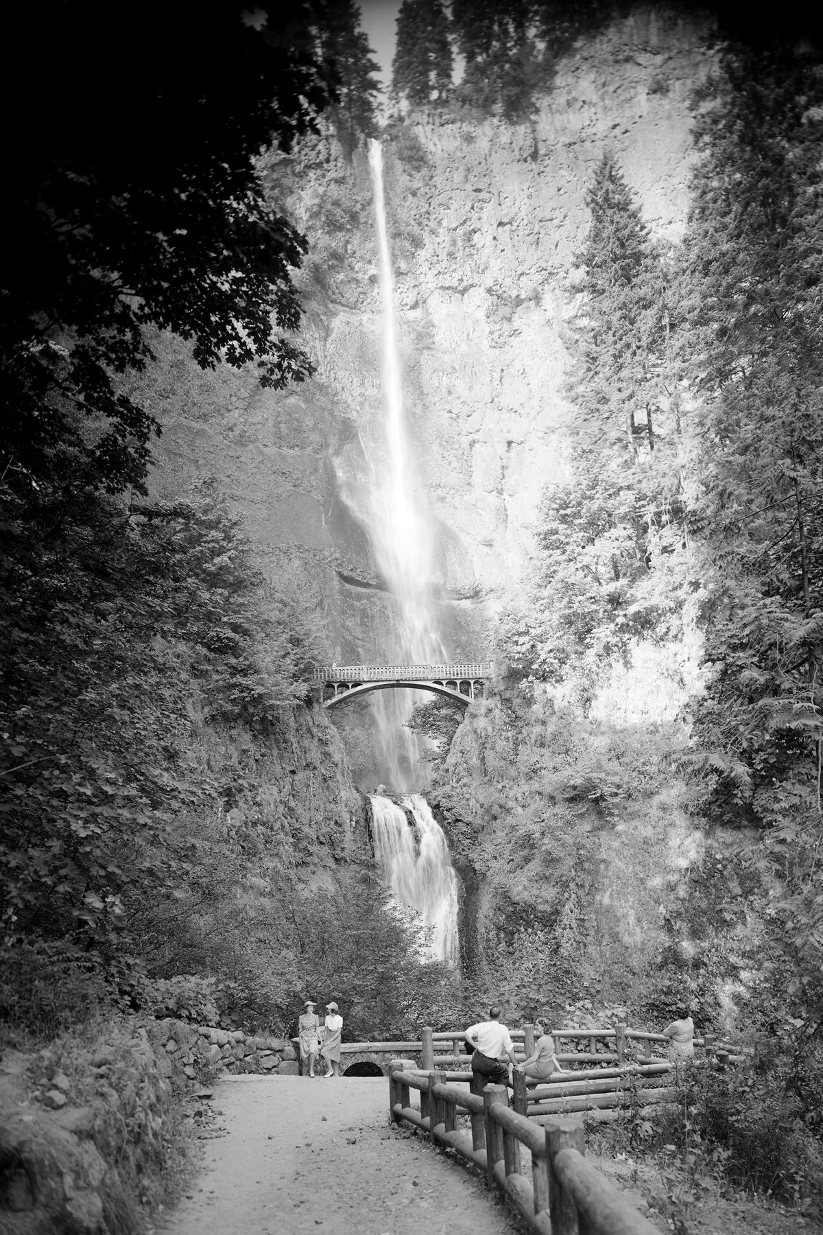Black-and-white photograph: Multnomah Falls. Location: Multnomah Falls, Columbia River Gorge, Oregon.