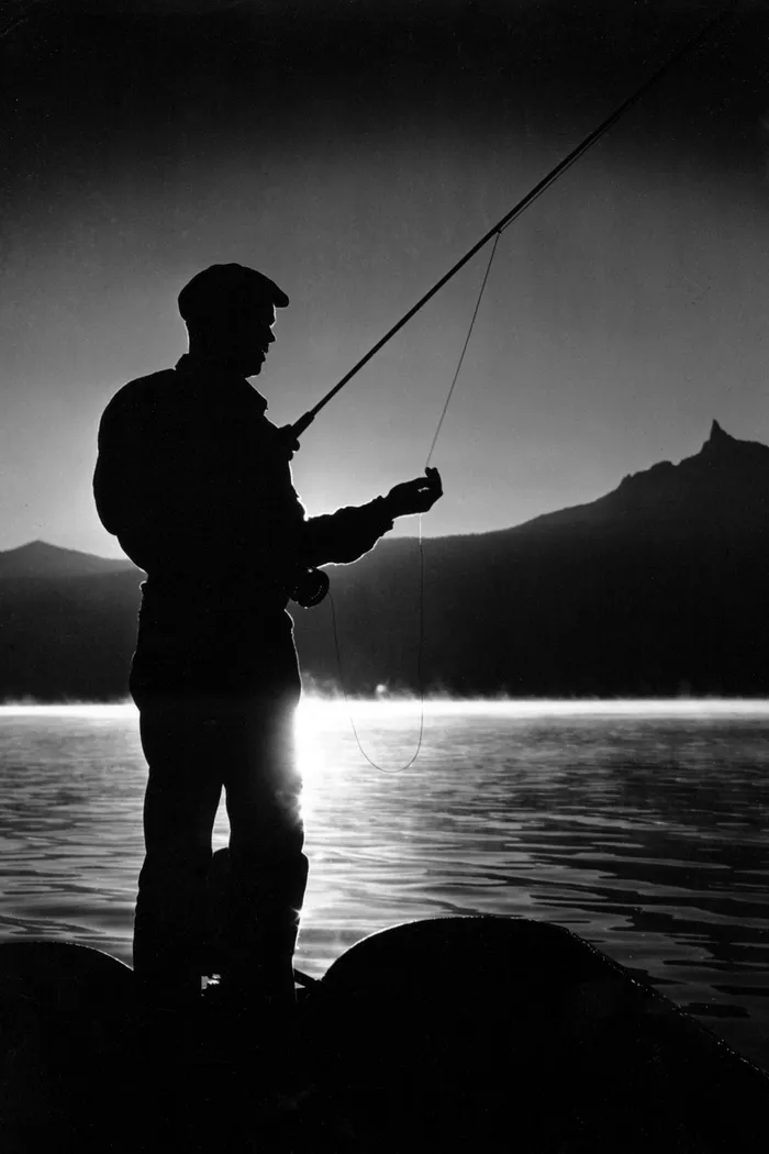 Black-and-white photograph: Alpine Lake Fishing, 1940s.