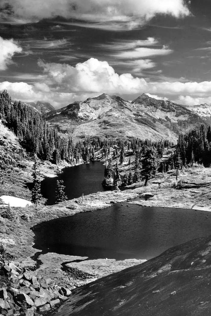 Black-and-white photograph: Alpine Lake, 1940s.