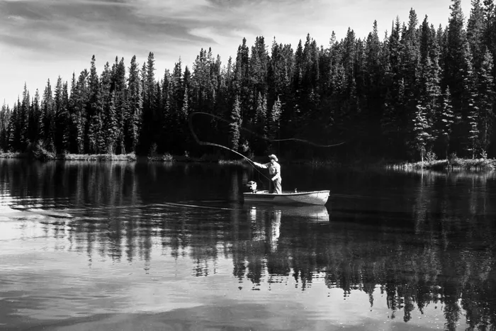 Black-and-white photograph: Alpine Lake Fishing Boat, 1940s.